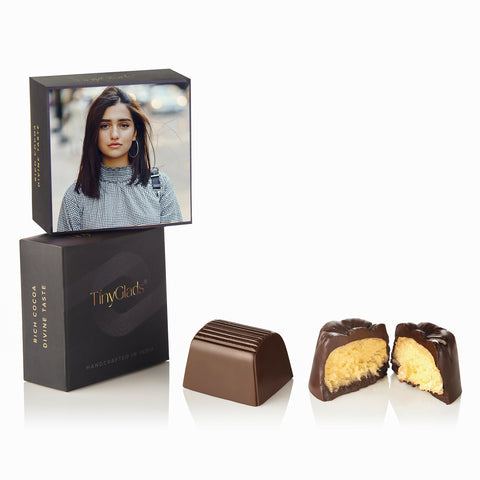 handcrafted chocolates in a decorated gift box.