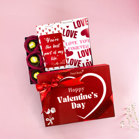 All-in-One Valentine gift box with assorted truffles, chocolate bars, soft toy, candle, and heart bracelet