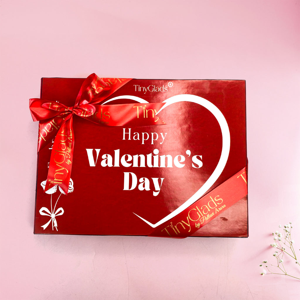 Luxury Valentine gift set with artisan chocolates, plush toy, candle, and heart-shaped bracelet